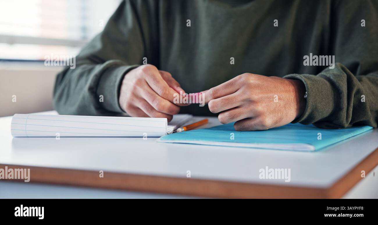 Student, hands and cheating with note in exam for test information, secret answer and knowledge fraud. School, person and assessment plagiarism in Stock Photo