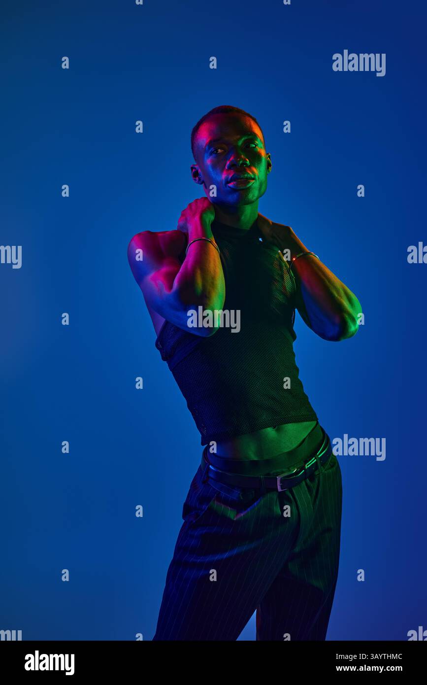 A young african american man displays his vibrant style confidently ...