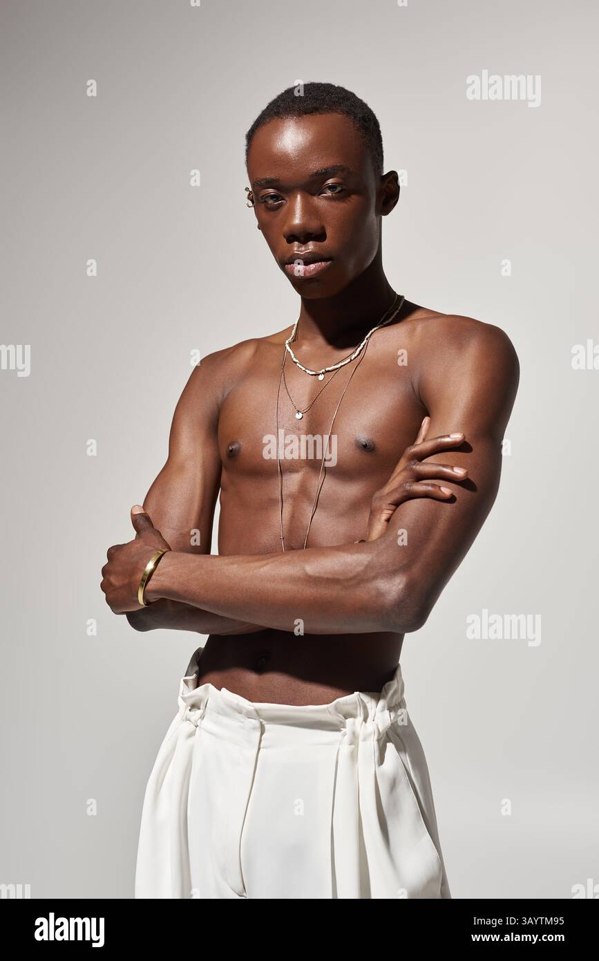 Stylish young african american man poses confidently, showcasing his ...