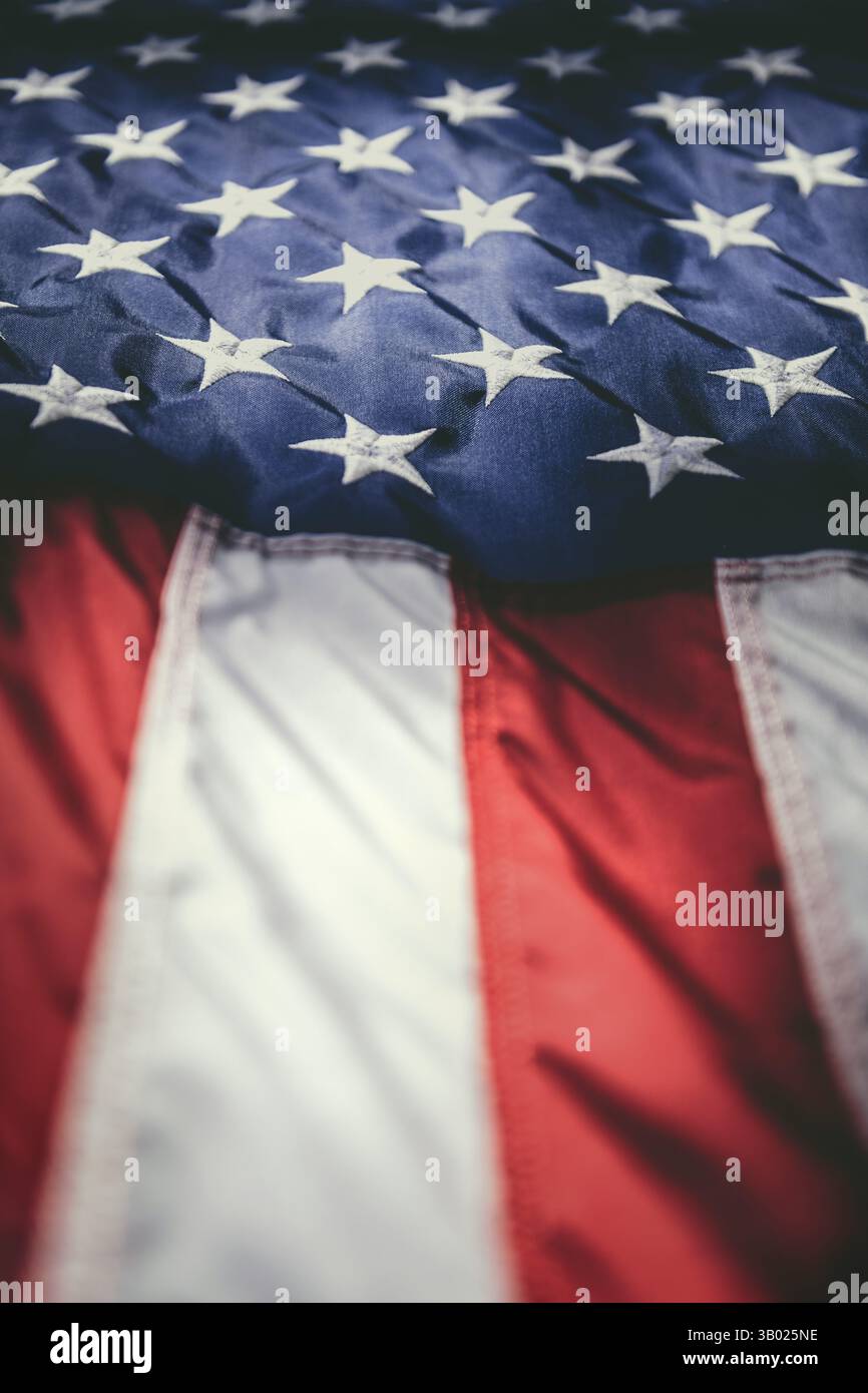 A close-up shot captures the iconic Stars and Stripes of the American ...