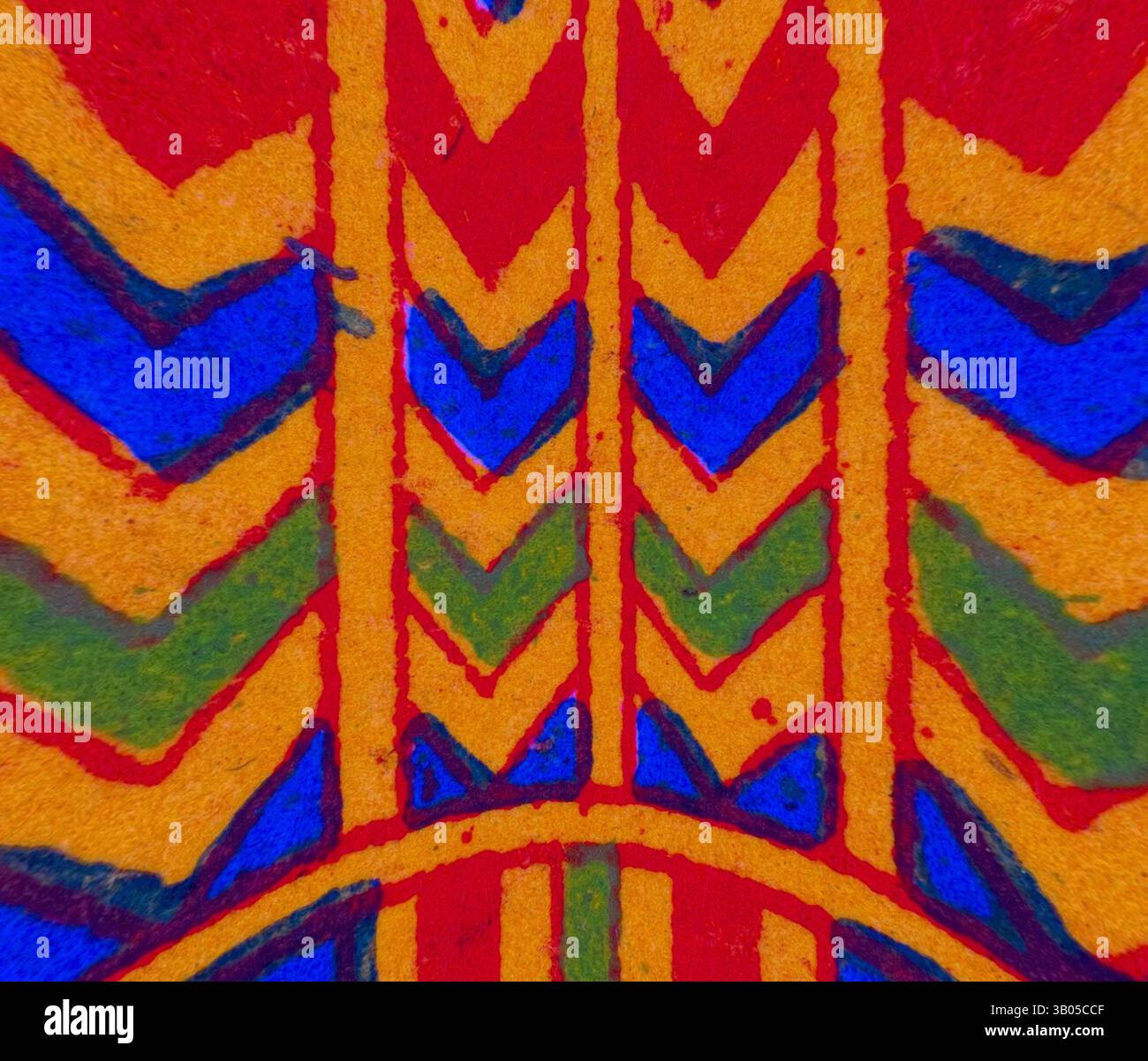 A vibrant pattern featuring bold zigzag shapes and vibrant hues of red ...