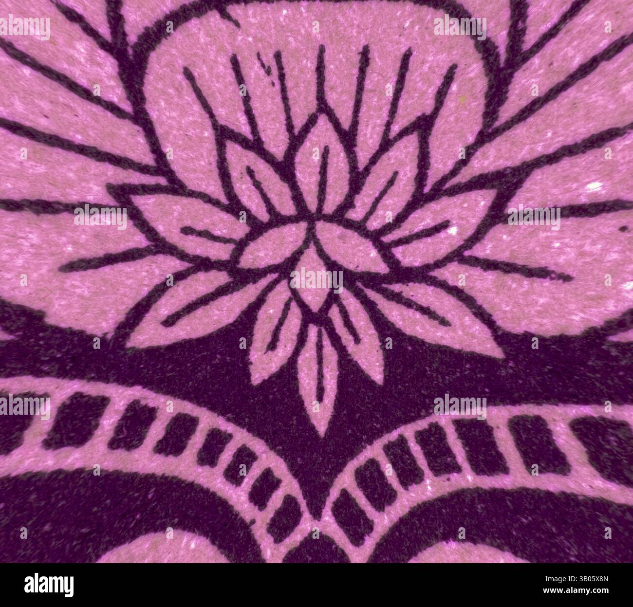 An intricate floral design features a central flower surrounded by ...