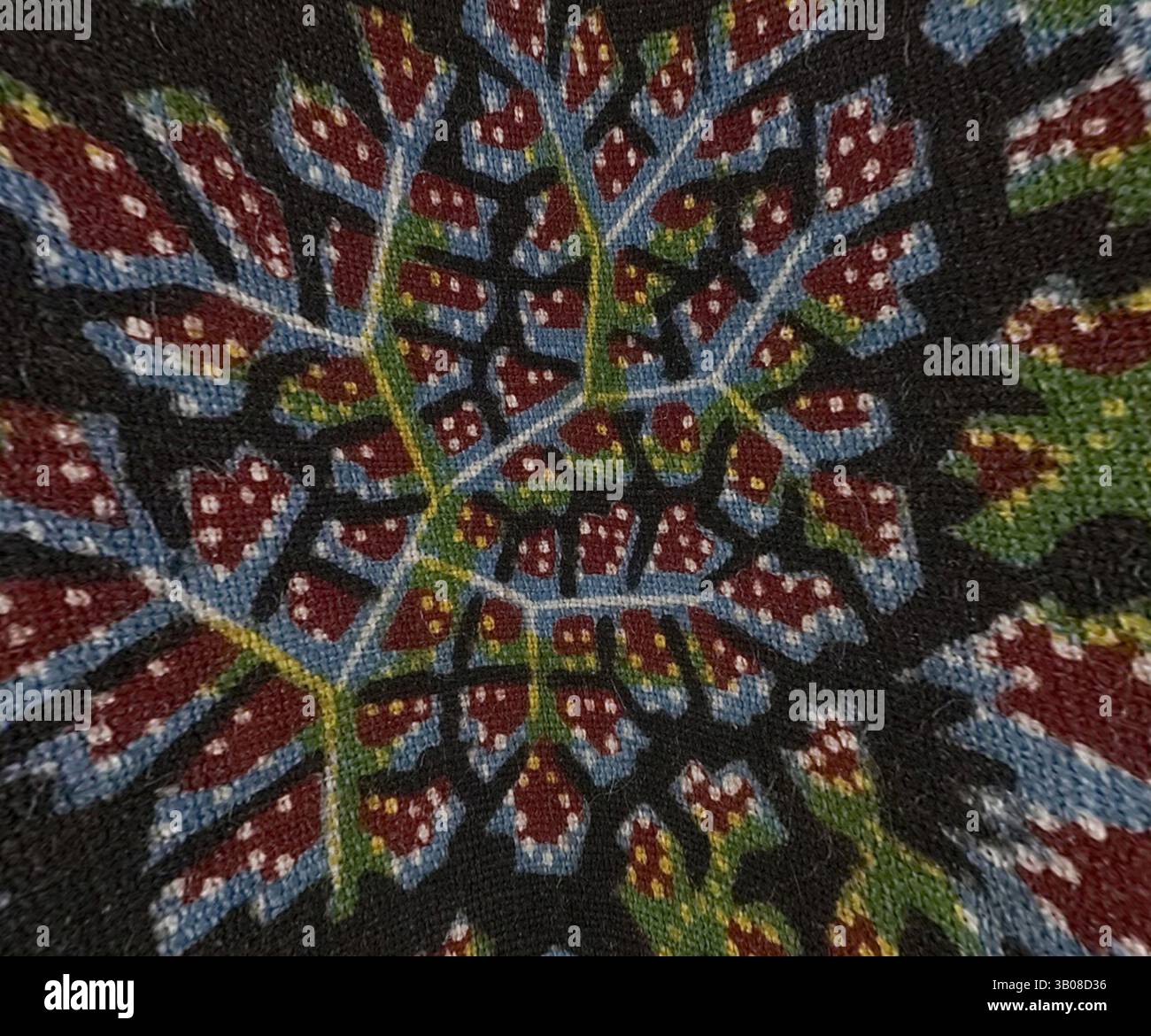 A vibrant tapestry featuring intricate floral and leaf patterns in bold ...
