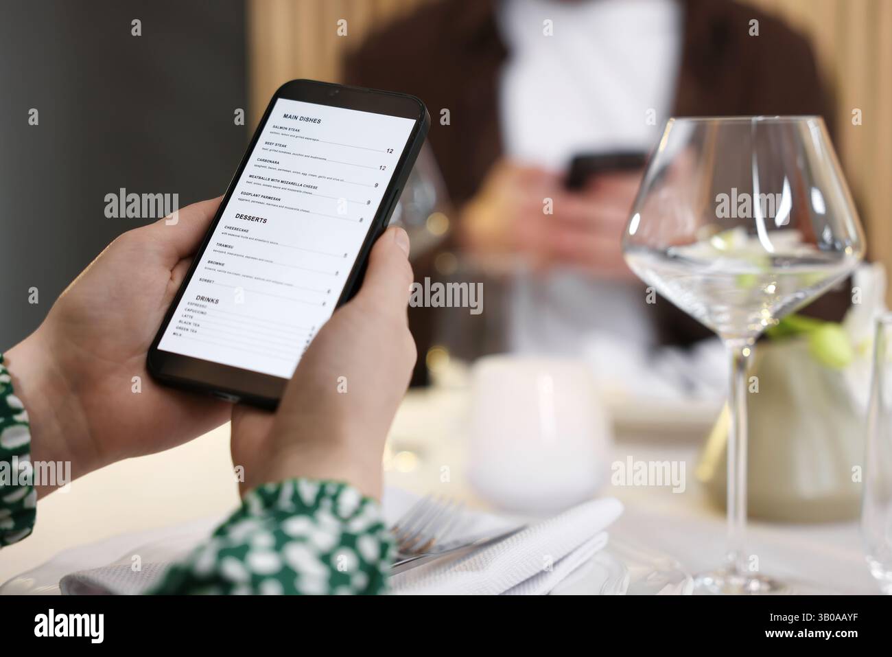 Couple choosing dishes from digital menu at restaurant, closeup Stock ...