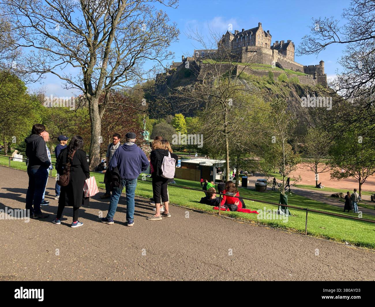 Tour Guide with Tour party in Princes Street Gardens, Edinburgh Scotland - Smartphone Captured Stock Image