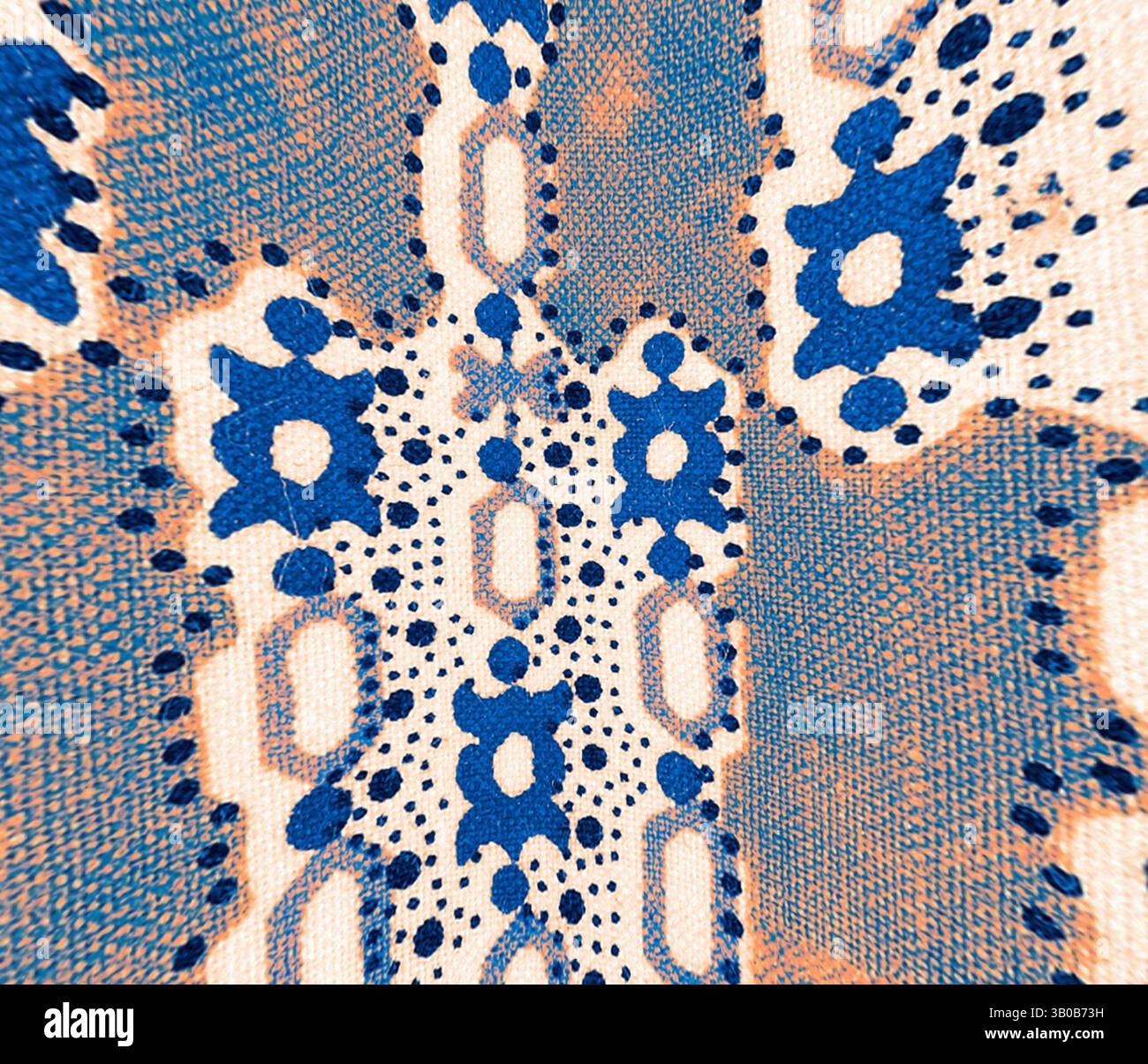 A vibrant textile featuring an intricate pattern of bold blue shapes ...