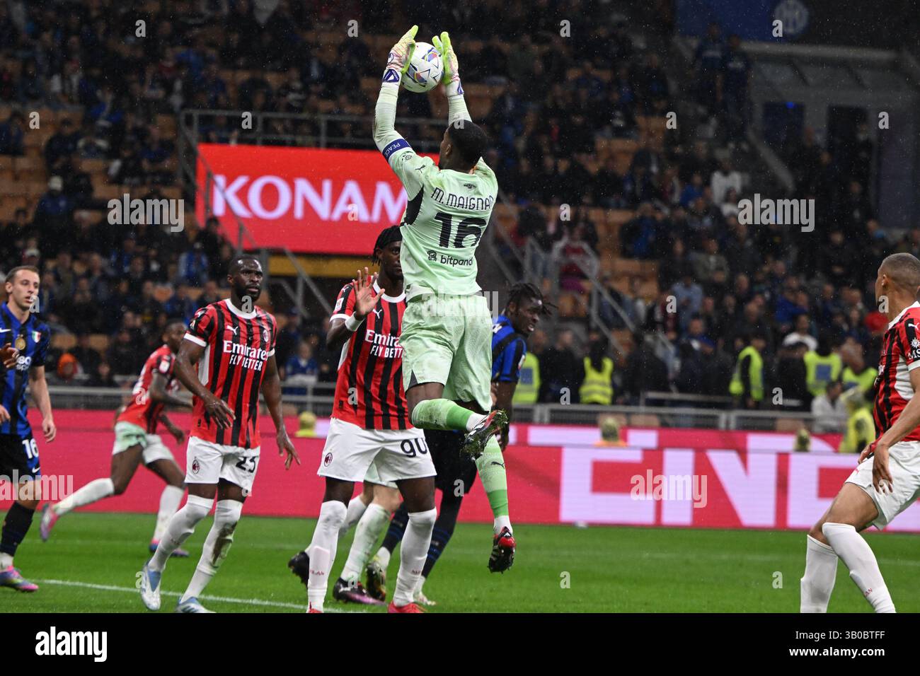 Mike Maignan of AC Milan in action during the Italian Cup Semi Final ...