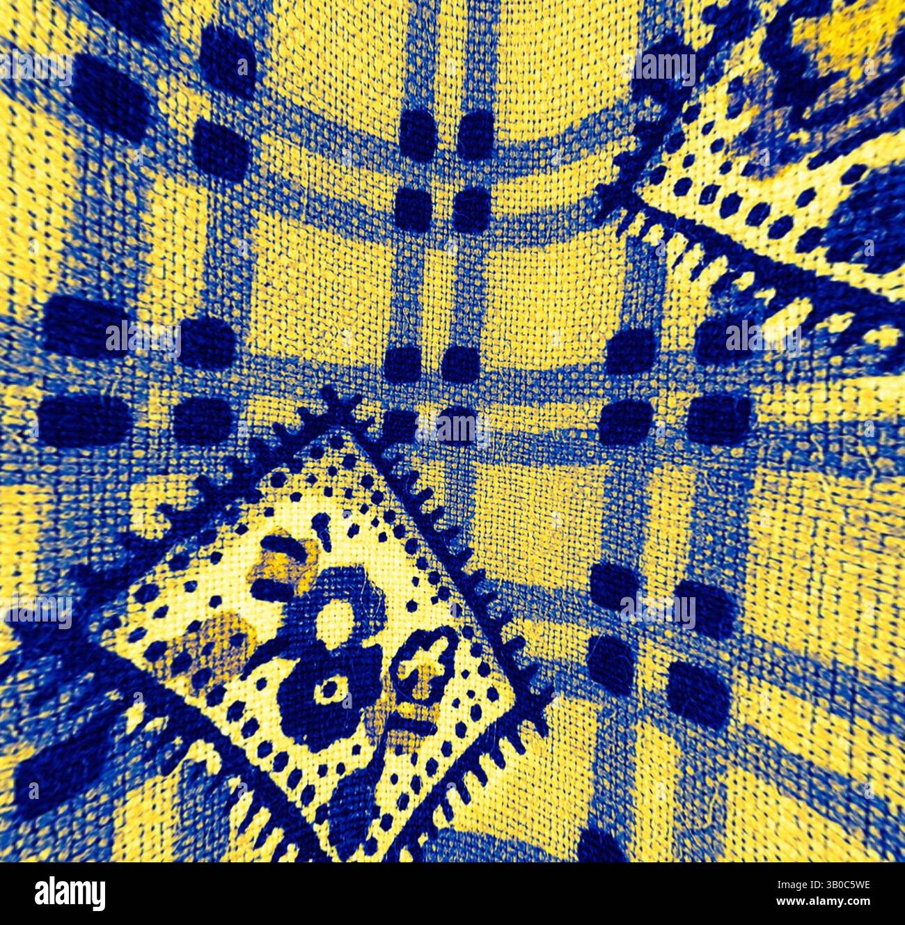 A vibrant textile featuring a dynamic pattern with bold yellow and blue ...