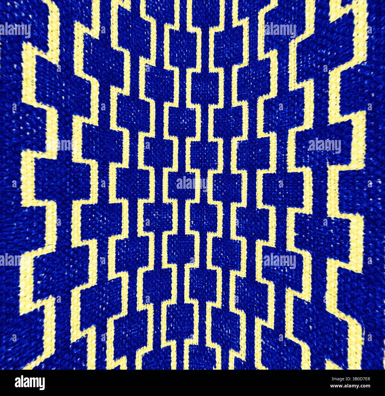A vibrant textile featuring a geometric pattern of interlocking blue ...
