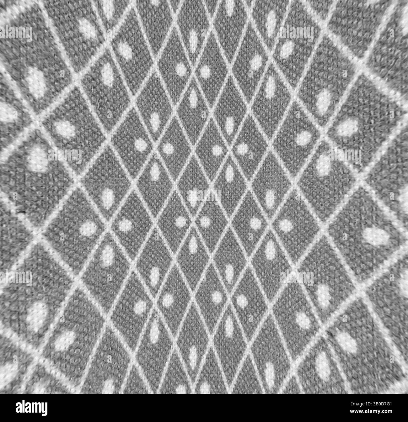 A textured pattern featuring a series of intersecting diamonds and ...