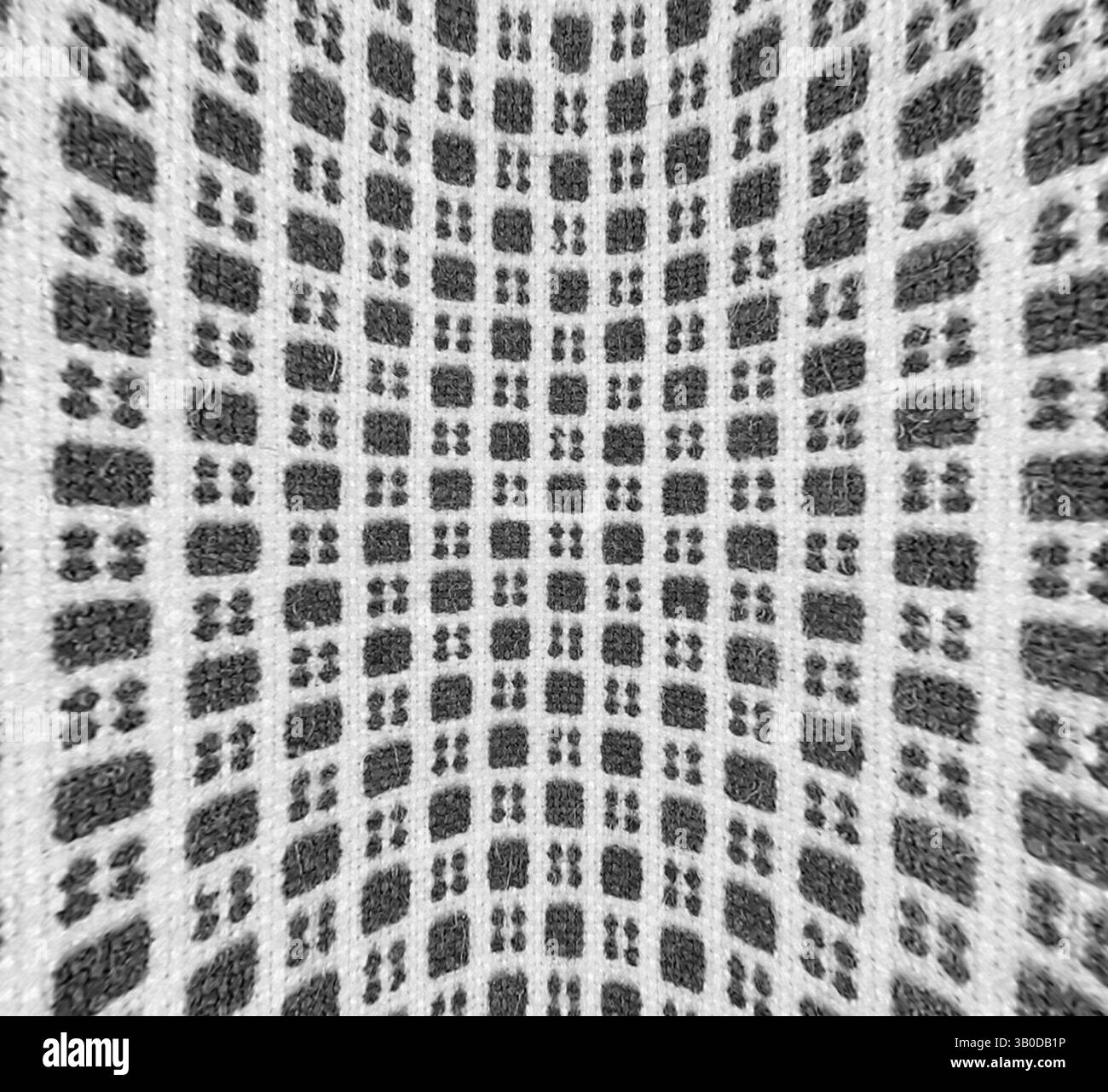A textured pattern featuring a grid-like design with contrasting ...