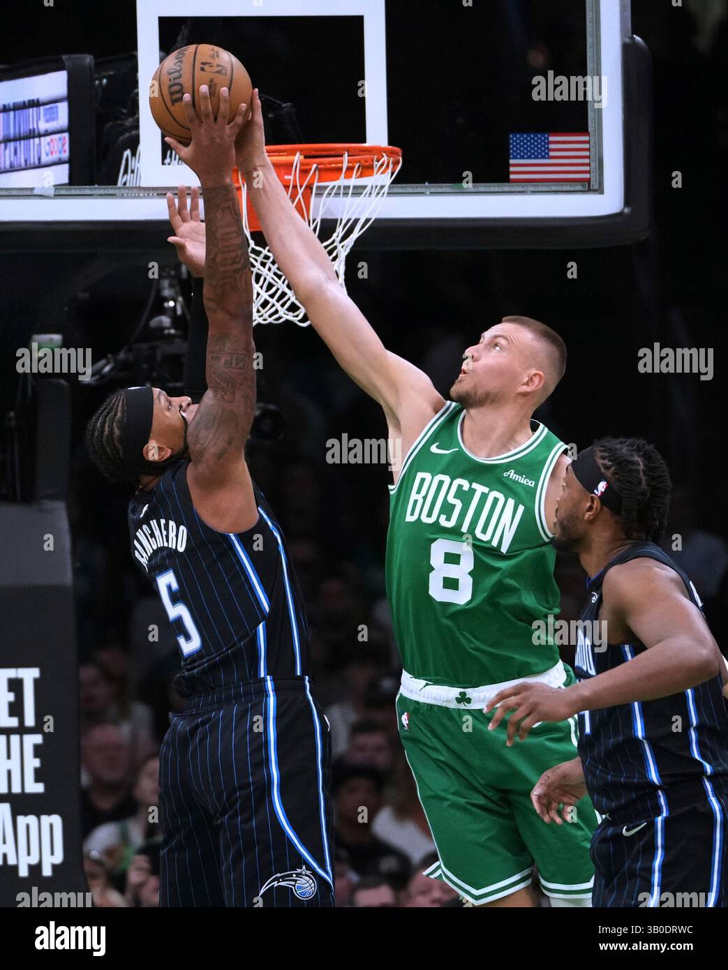 Boston Celtics center Kristaps Porzingis (8) blocks a shot by Orlando