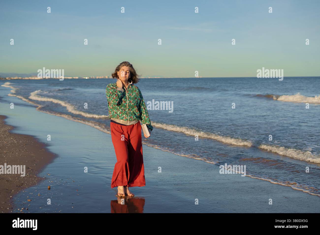 Woman walks barefoot on serene hi-res stock photography and images - Alamy