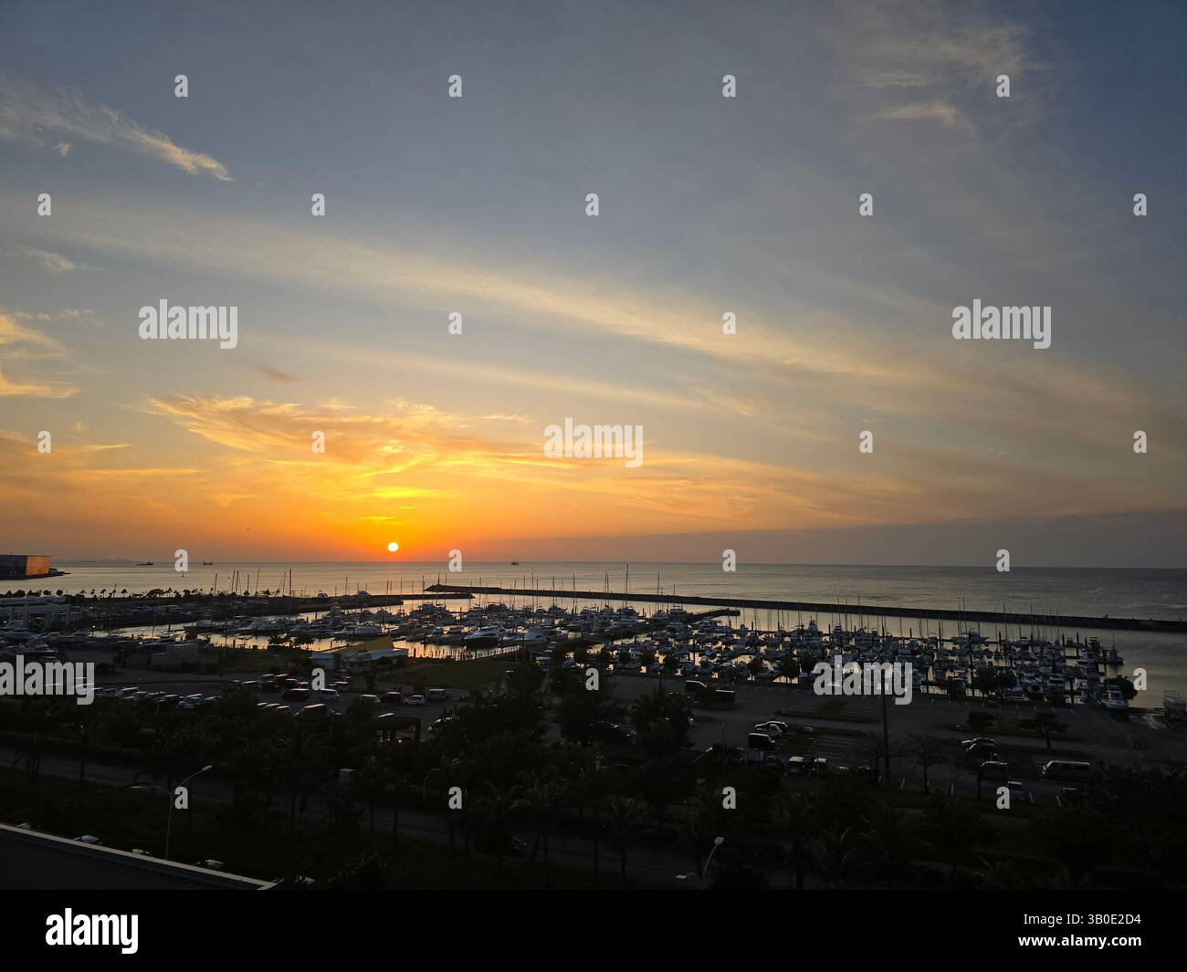 A dreamy sunset over the marina in Ginowan, Okinawa, Japan. - Smartphone Captured Stock Image