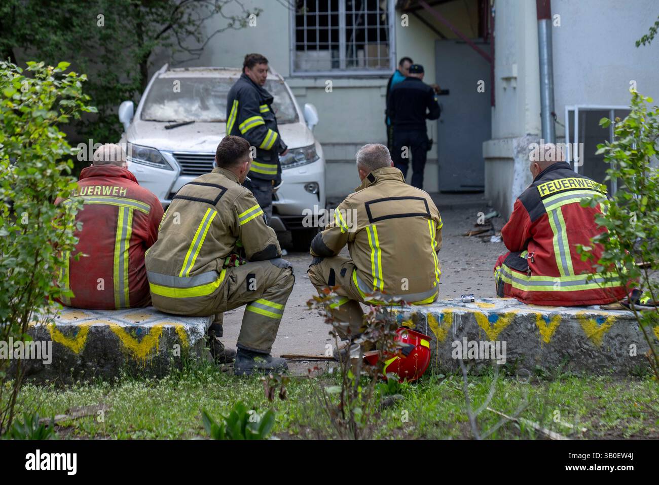 Ukraine Firemen Firemen take a break at site of destruction after a Russian missile ...