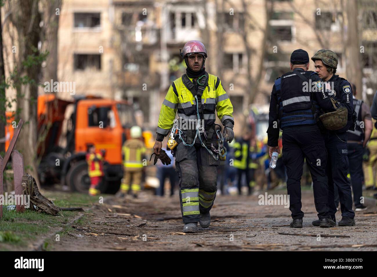 Ukraine Firemen A firemen is seen walking away from impact site after a Russian missile ...