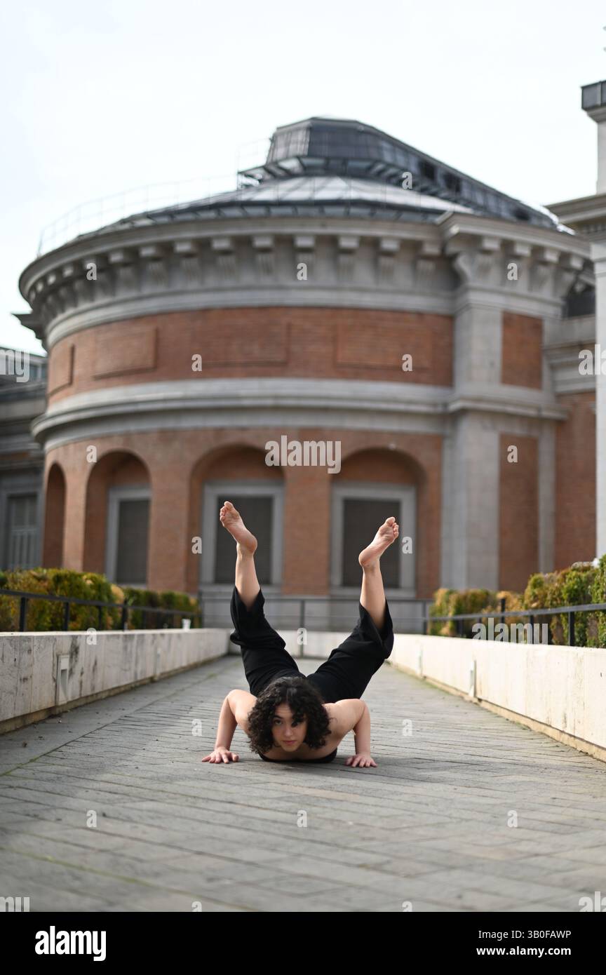 Beautiful ballerina dancing on street in the city Stock Photo