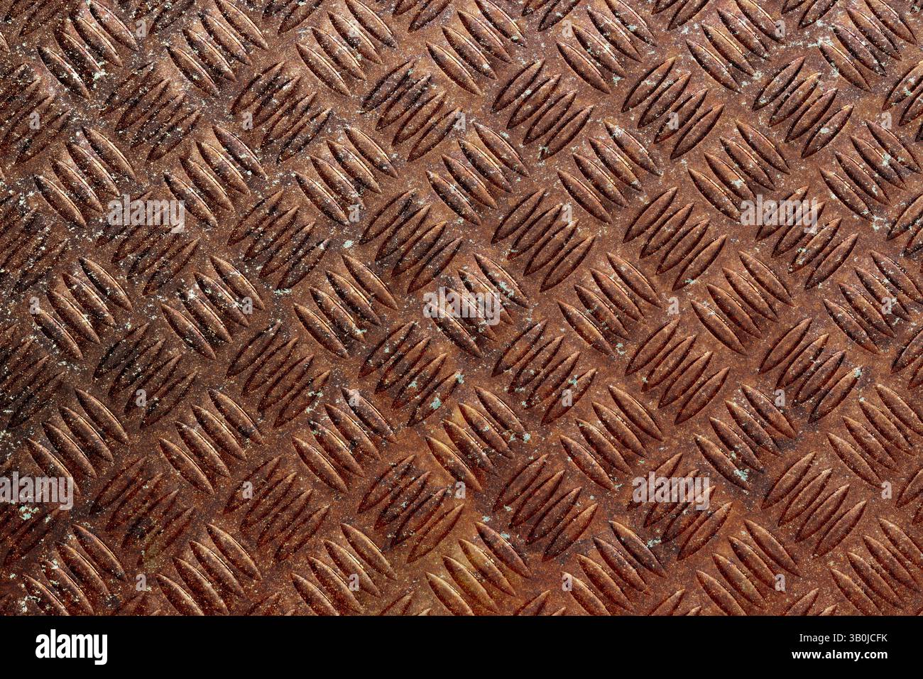 Rusty steel checker plate grunge background. Rusty aged industrial material concept Stock Photo