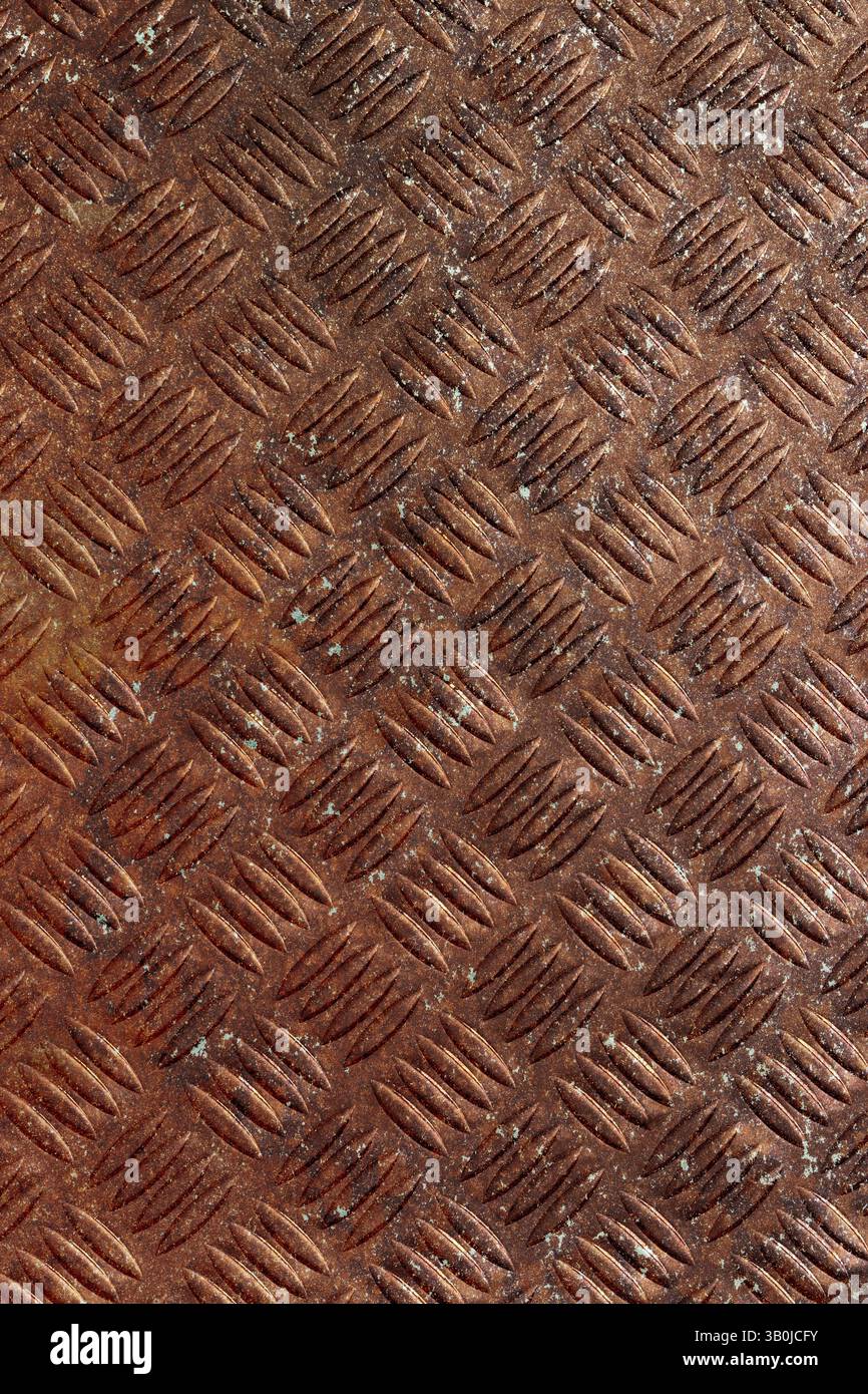 Rusty steel checker plate grunge background. Rusty aged industrial material concept Stock Photo