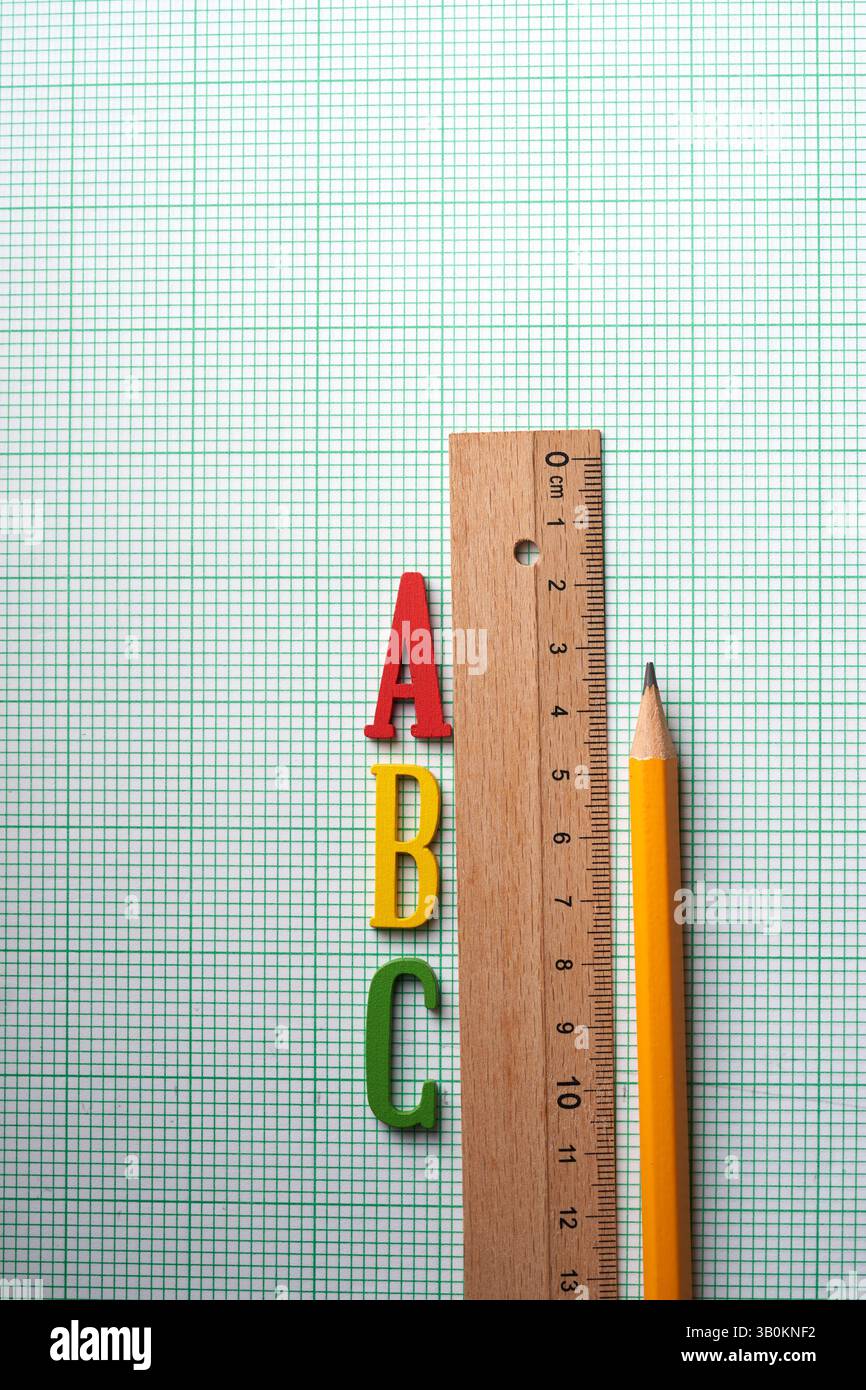 ruler pencil and letter a b c on graph paper Stock Photo - Alamy