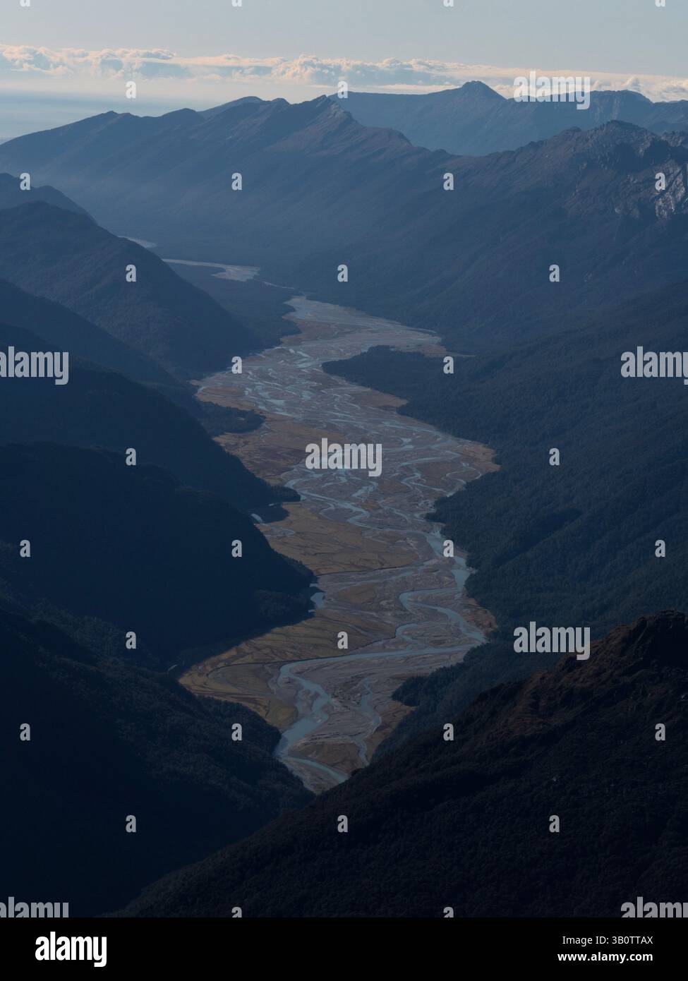 Aerial view of a bend river meander winding through Southern Alps ...