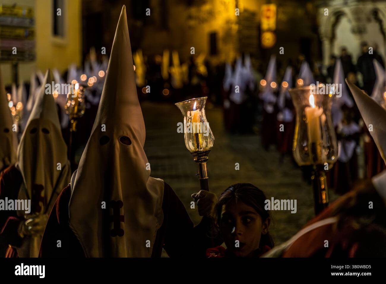 Procession in Cuenca with participants in robes and with candles. Bajada San Miguel, Cuenca, Castilla-La Mancha, Spain Stock Photo