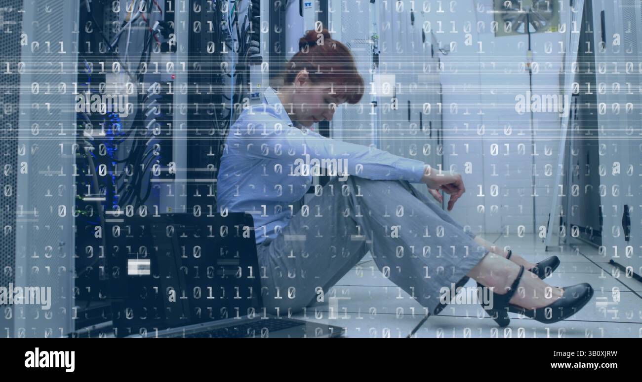 Image of interference and binary coding over caucasian woman in server room Stock Photo