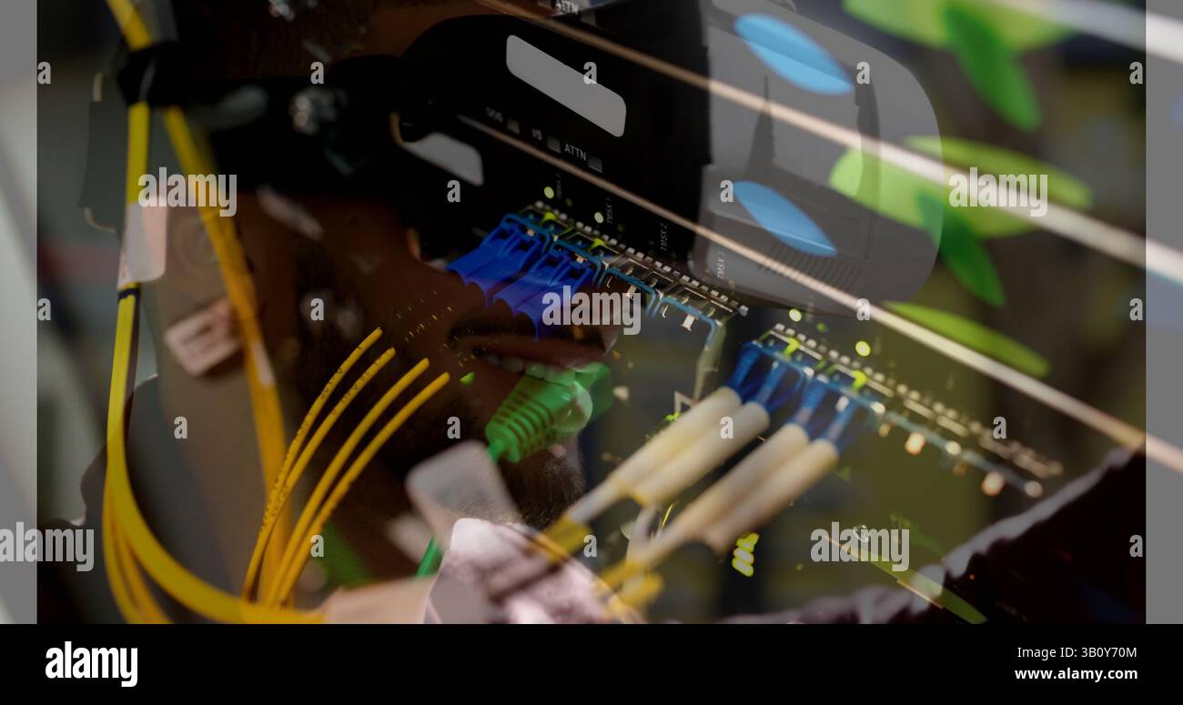 Image of server room over biracial man using vr headset Stock Photo