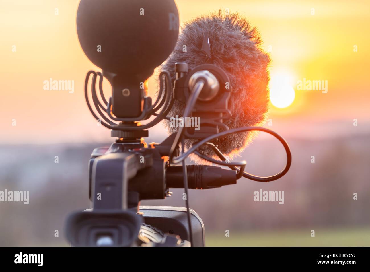 Camera and microphones on tripod in mountains with sunset near Vysoke nad Jizerou CZ 04 12 2025 Stock Photo