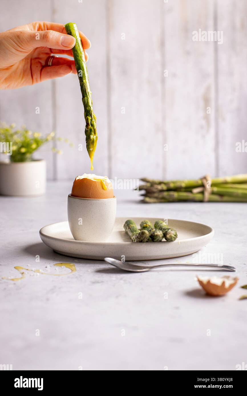 Soft boiled egg with grilled asparagus Stock Photo
