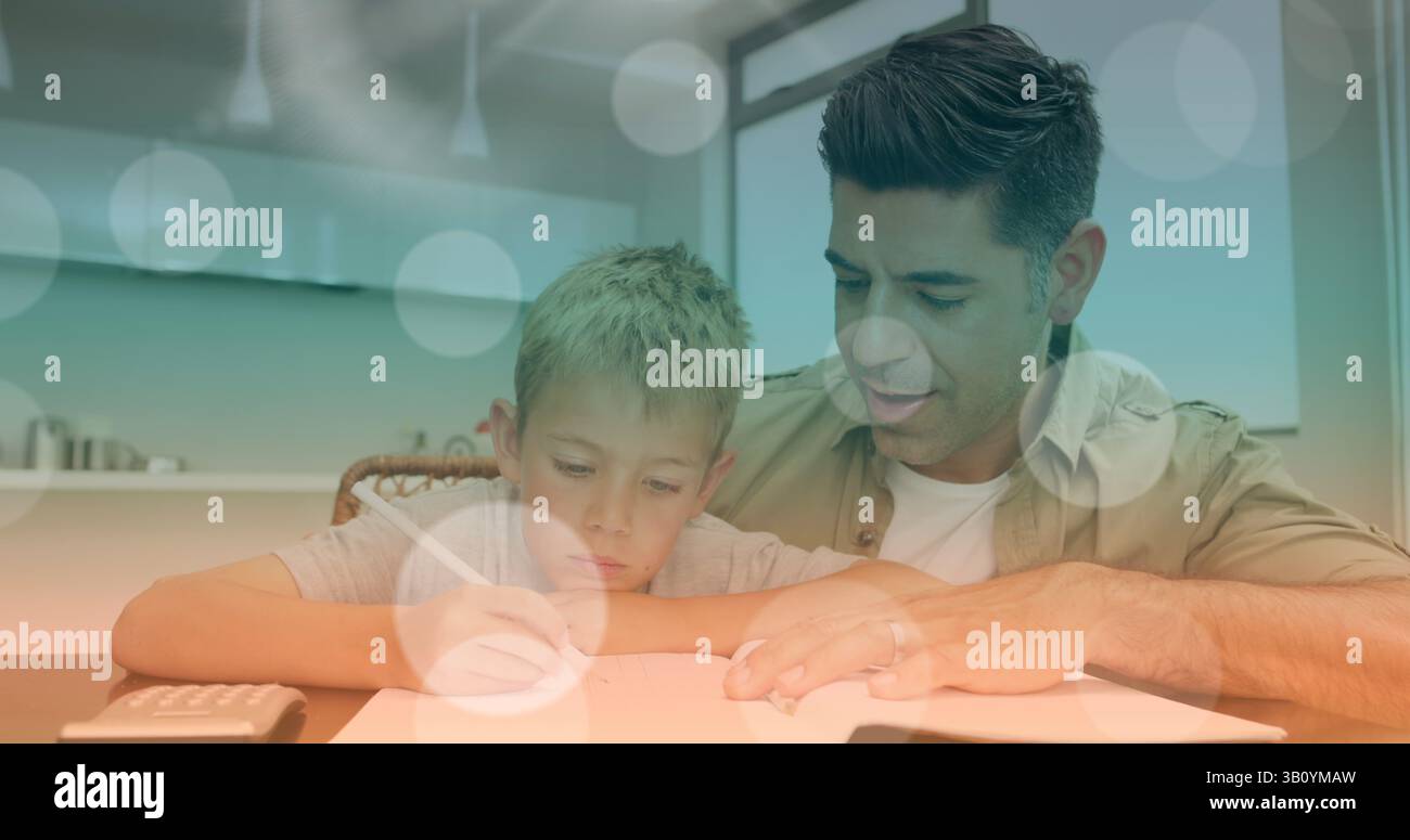 Image of bokeh over happy caucasian father helping son doing homework Stock Photo