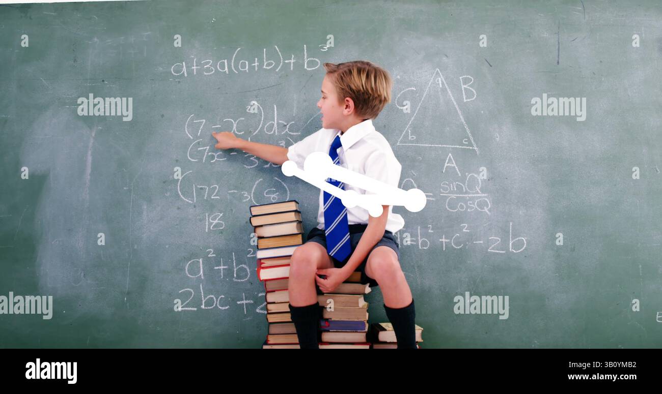 Image of geometrical shapes over caucasian boy writing on blackboard Stock Photo