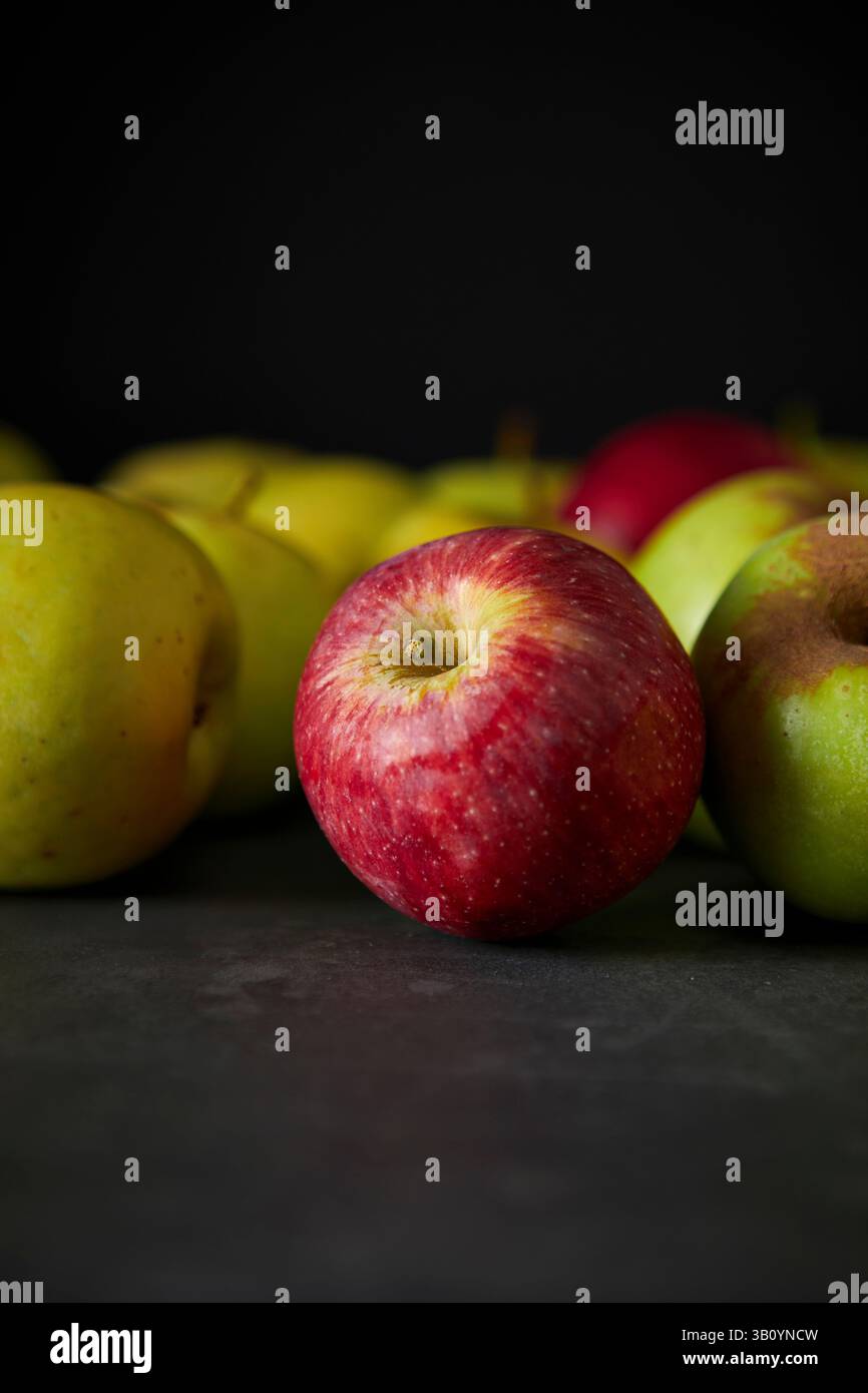 Red and Green Apples on Dark Background Stock Photo