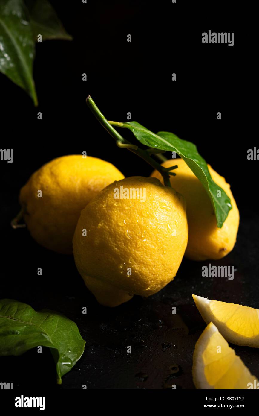 Fresh whole lemons with leaves Stock Photo