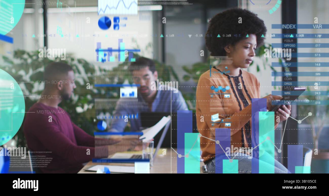 Statistical data processing against thoughtful african american woman using digital tablet at office Stock Photo