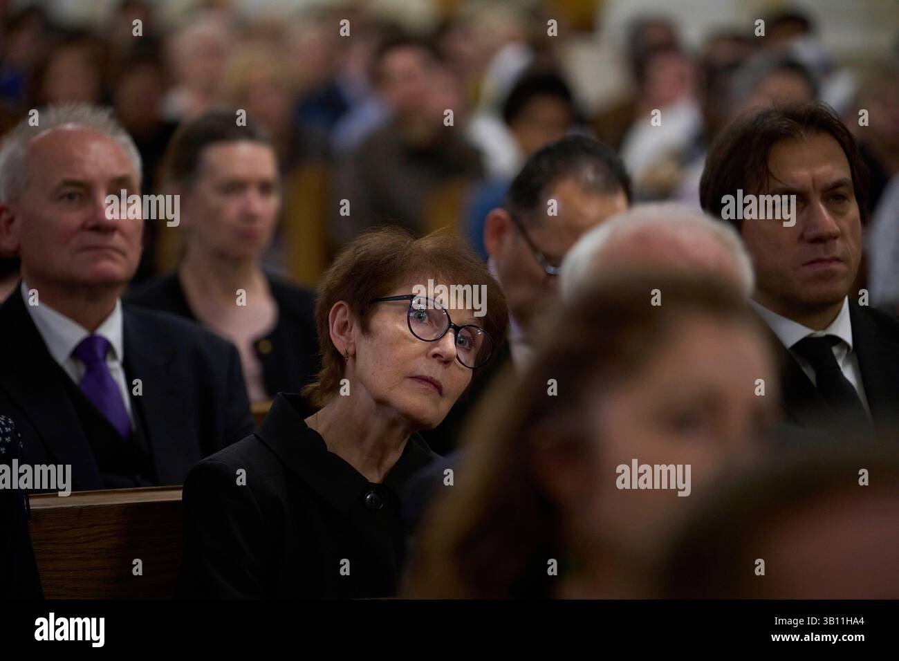Faithful attend a mass to commemorate the late Pope Francis at the
