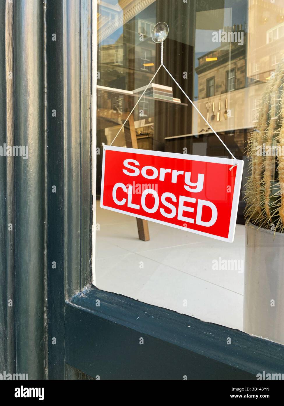 Sorry Closed sign on shop door - Smartphone Captured Stock Image