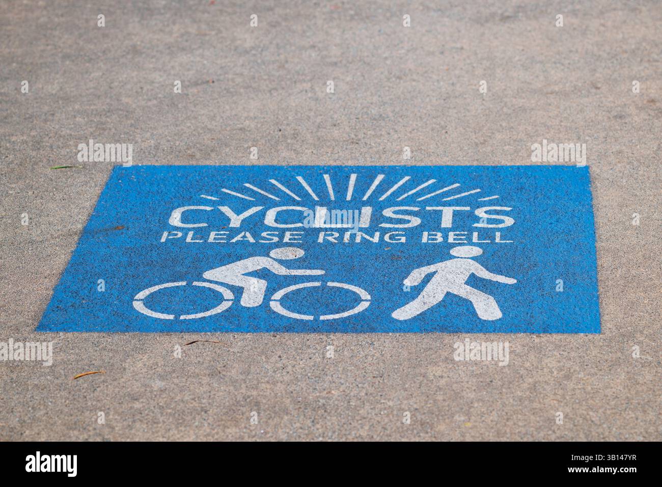 Cyclists please ring bell sign on the Promenade, Bongaree, Queensland ...