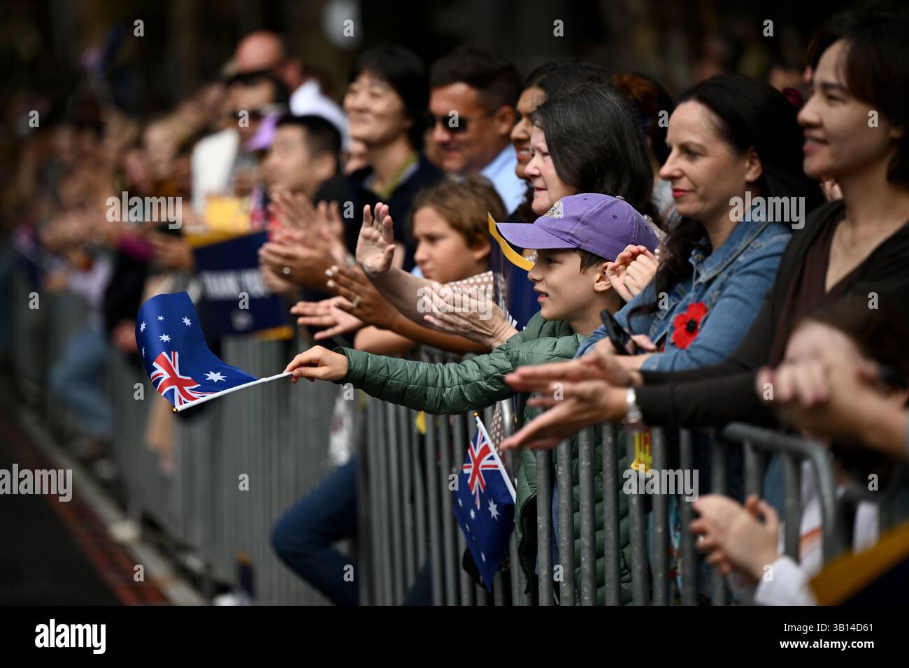 Sydney, Australia. 25th Apr, 2025. Spectators wave the Australian flag ...