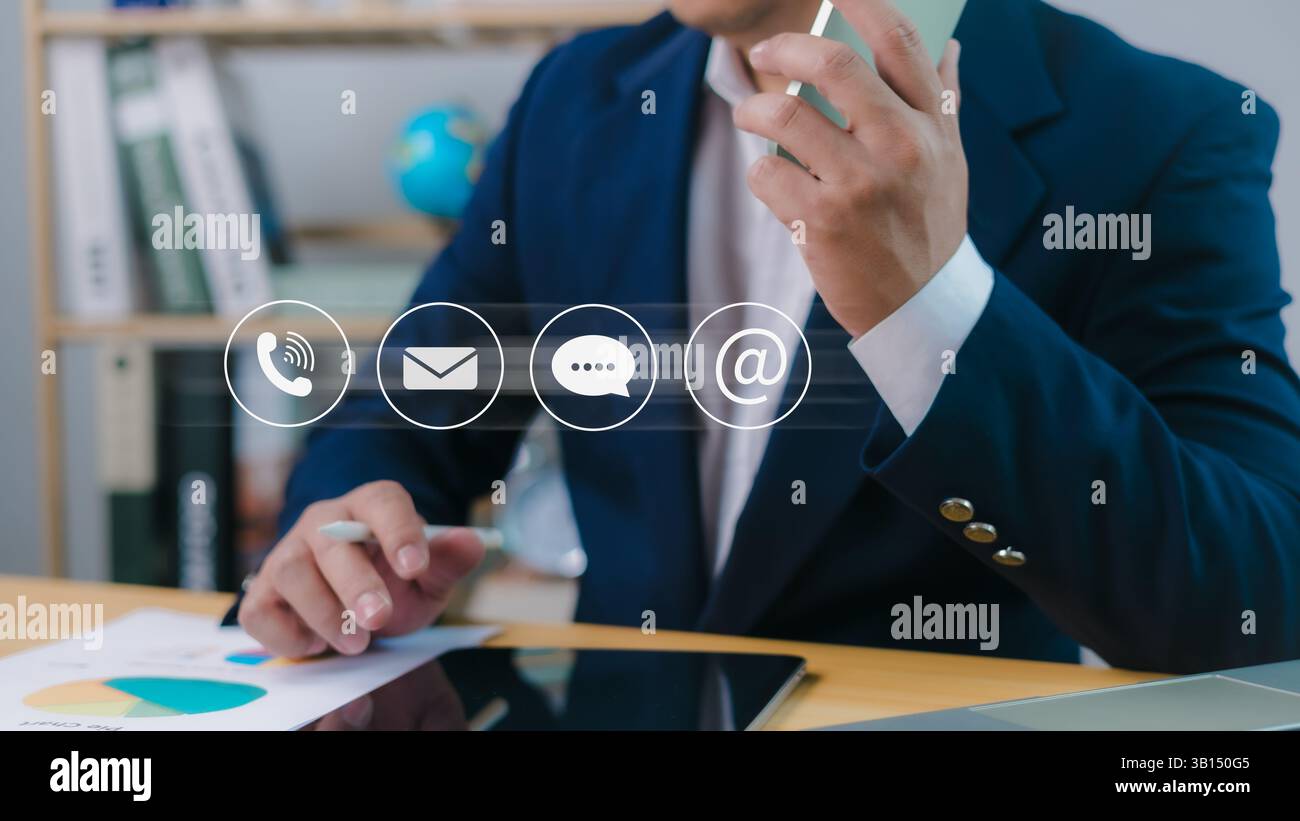 Contact us or email marketing concept, Website page, Customer support hotline, Contact us laptop online, Businessman sitting and working on tablet and Stock Photo