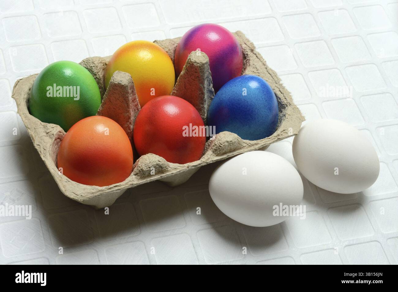 Colourful Easter eggs in packaging, Easter celebration Stock Photo