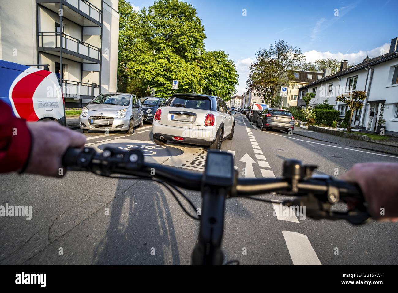 Cycling in the city, city centre road, cycle lane, two-wheeled traffic has priority, 30 km/h zone, cyclists' perspective, Essen, North Rhine-Westphali Stock Photo
