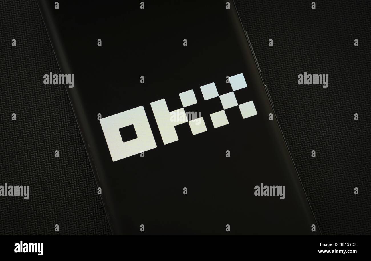Dhaka, Bangladesh - 17 March 2025: The logo of the okx is displayed on a smartphone screen Stock Photo