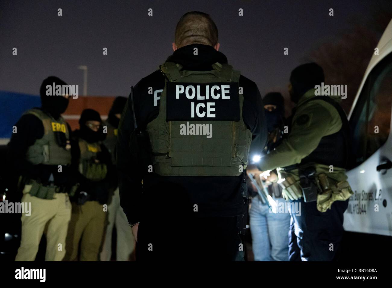 FILE - U.S. Immigration and Customs Enforcement officers gather for a ...