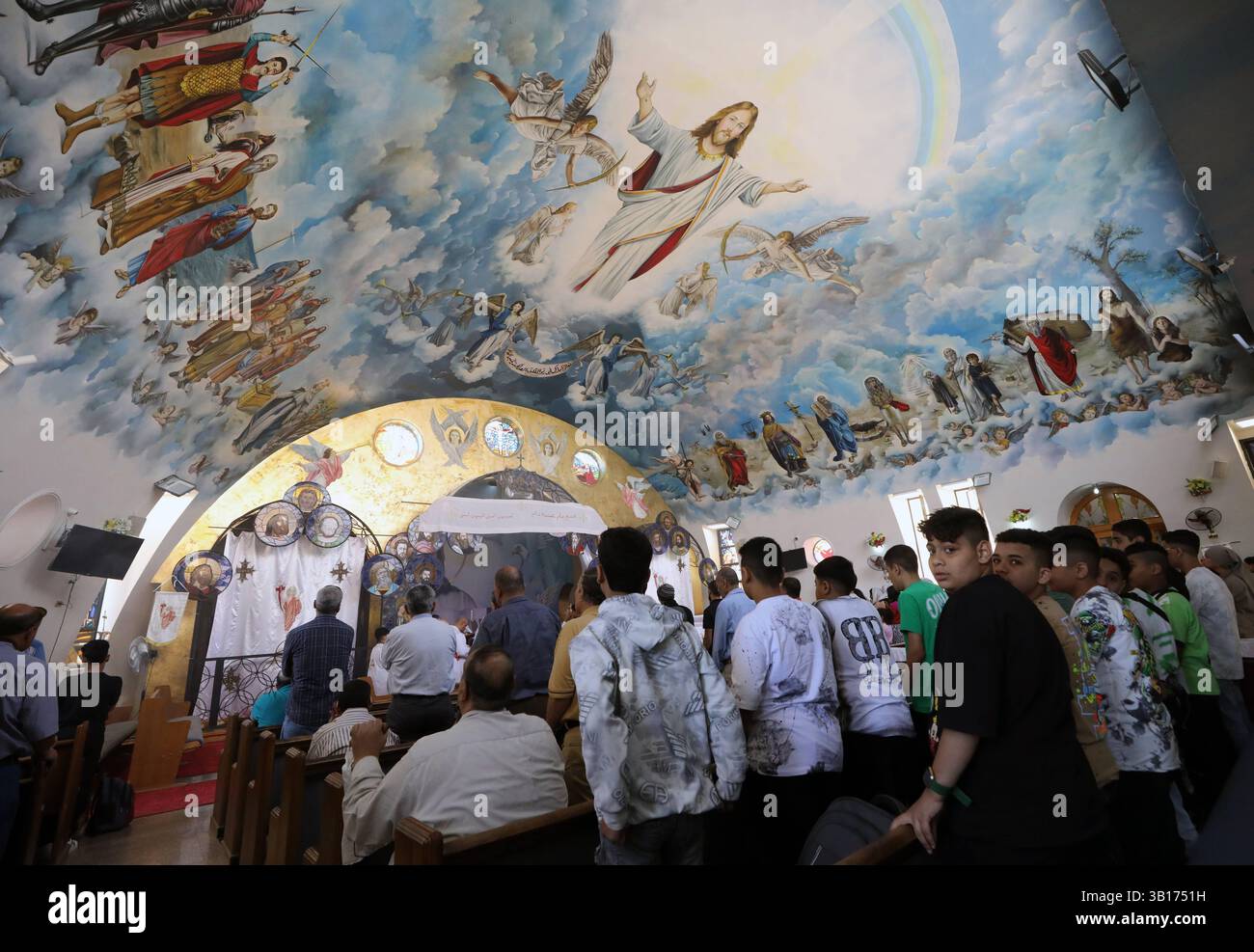 Mass baptism ceremony in Egypt Coptic prayer during a mass baptism ceremony inside Orthodox church at the Monastery of Patmos, ElShorouk city Cairo in Egypt, on April 25 2025. Cairo Egypt Copyright: xMatrixxImages/KhaledxElfiqix Stock Photo