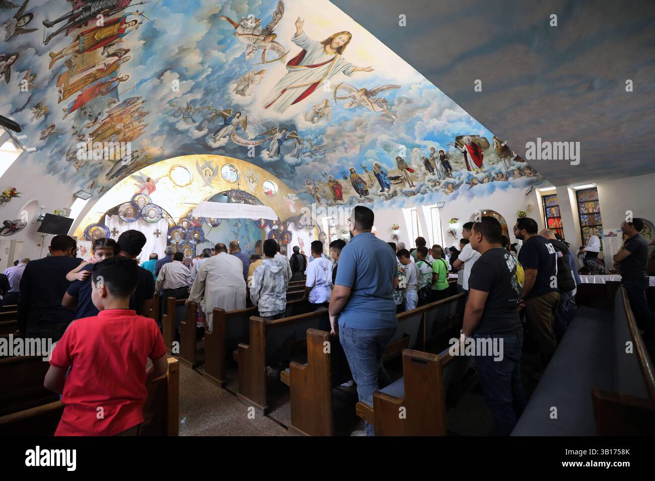 Mass baptism ceremony in Egypt Coptic prayer during a mass baptism ceremony inside Orthodox church at the Monastery of Patmos, ElShorouk city Cairo in Egypt, on April 25 2025. Cairo Egypt Copyright: xMatrixxImages/KhaledxElfiqix Stock Photo