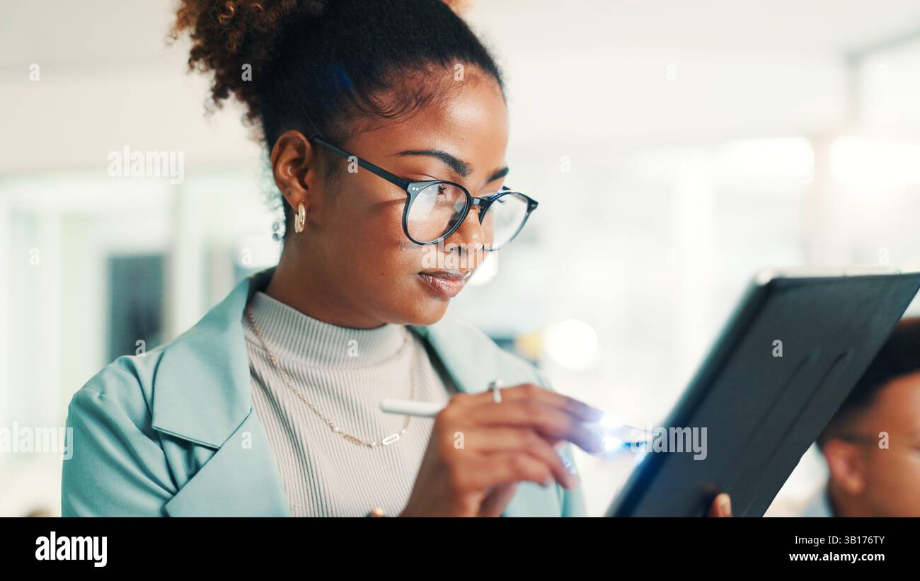 Programmer, woman and writing with tablet in office for coding, software update and web development. Programming, employee and testing digital app Stock Photo