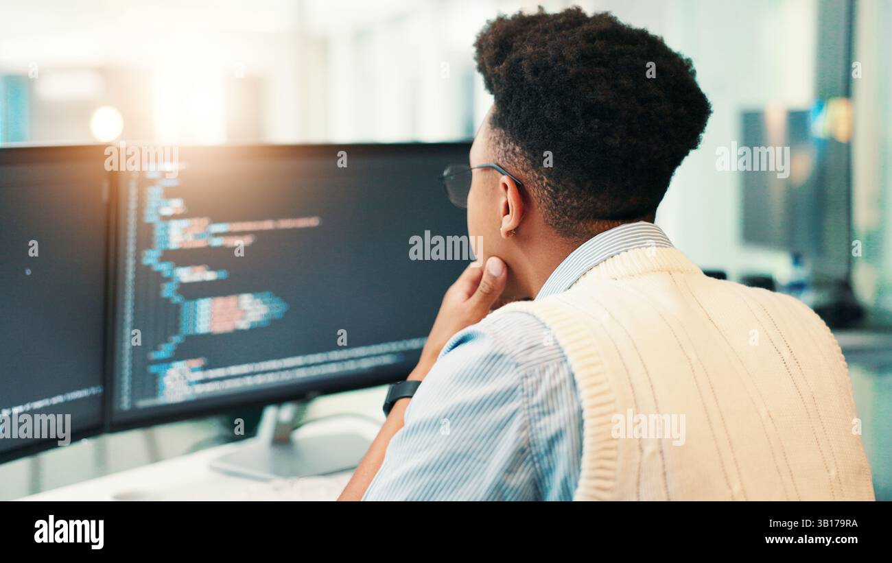 Coding, man and computer screen with thinking in office for programming solution, app development and debugging. Back, coder and data analytics for Stock Photo