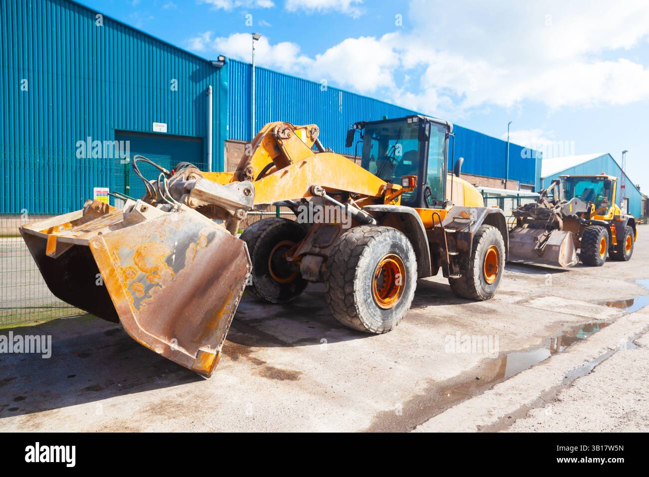 Wheeled bulldozers stand on the territory of the seaport Stock Photo ...