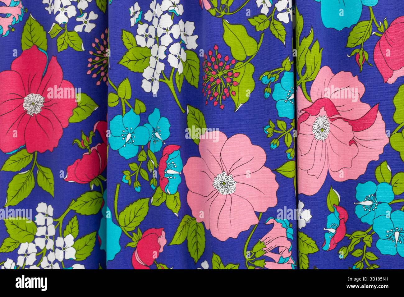 Colorful floral fabric pattern on violet background Stock Photo